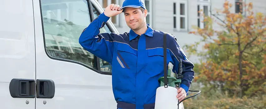 Cockroach exterminator treating a Katy home